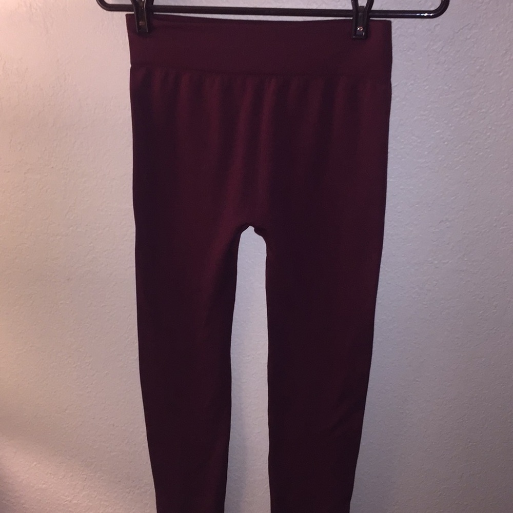 Never worn maroon colored leggings