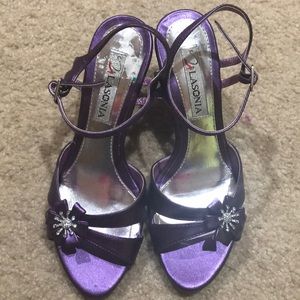 Woman’s purple heels