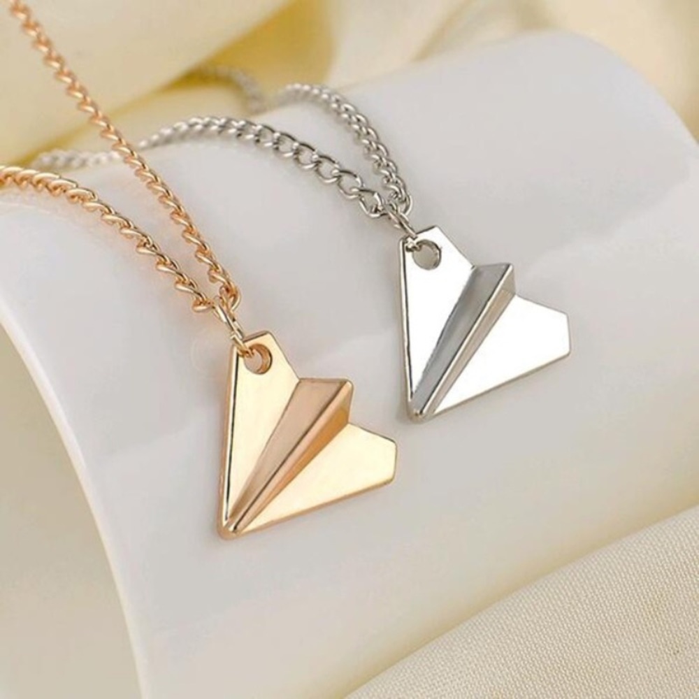 ✈️ Awesome metallic  paper airplane necklace available in silver or gold ✈️