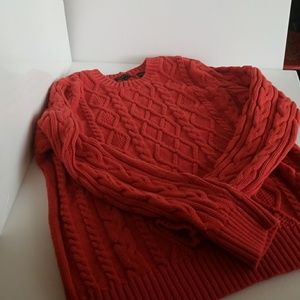 Large orange cableknit sweater