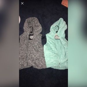 Two sleeveless vanity zip up sweatshirts