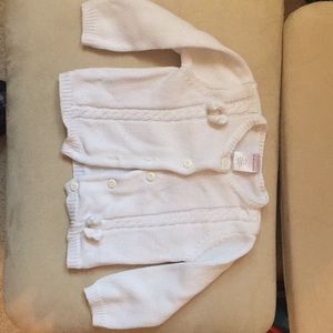 White sweater with bow details