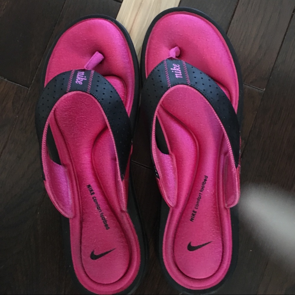 Pink Nike flip flops