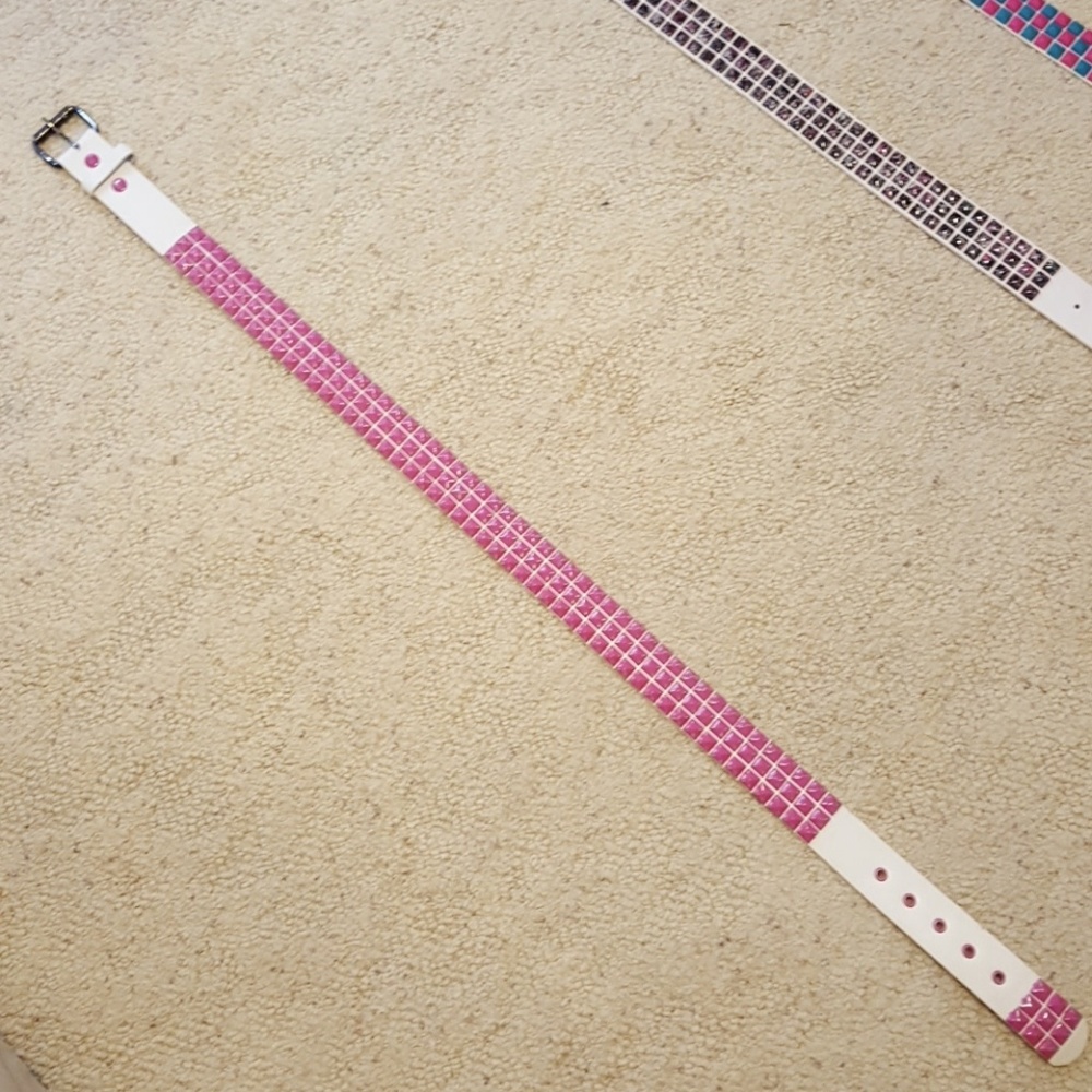 White leather with pink metal studs
