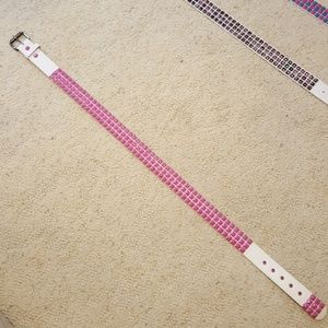White leather with pink metal studs