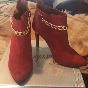 Red booties with gold chain