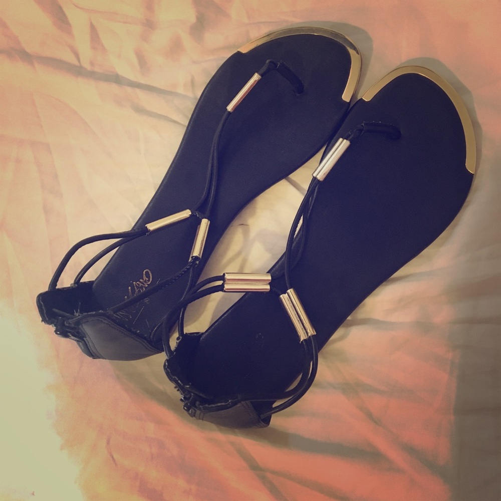 Gold and black sandals