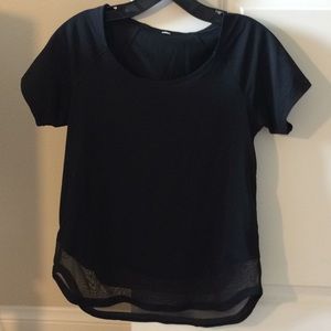 Lululemon black tee with mesh on bottom.