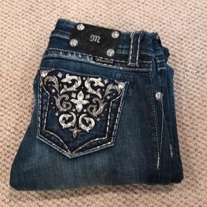 Boot cut Miss Me jeans.