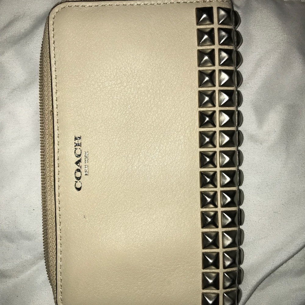 Coach small wristlet. Cream with silver studs.