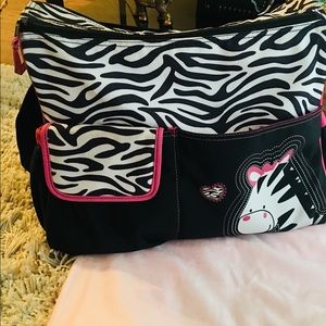 Diaper bag and a free changing new pad