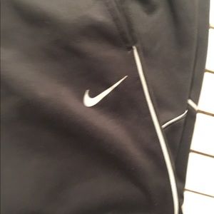 Girl’s black Nike therma-fit joggers.