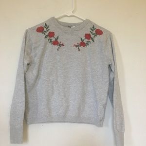 a light grey long sleeved top