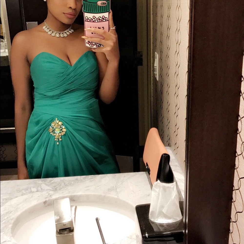 Green strapless gown with split and a train