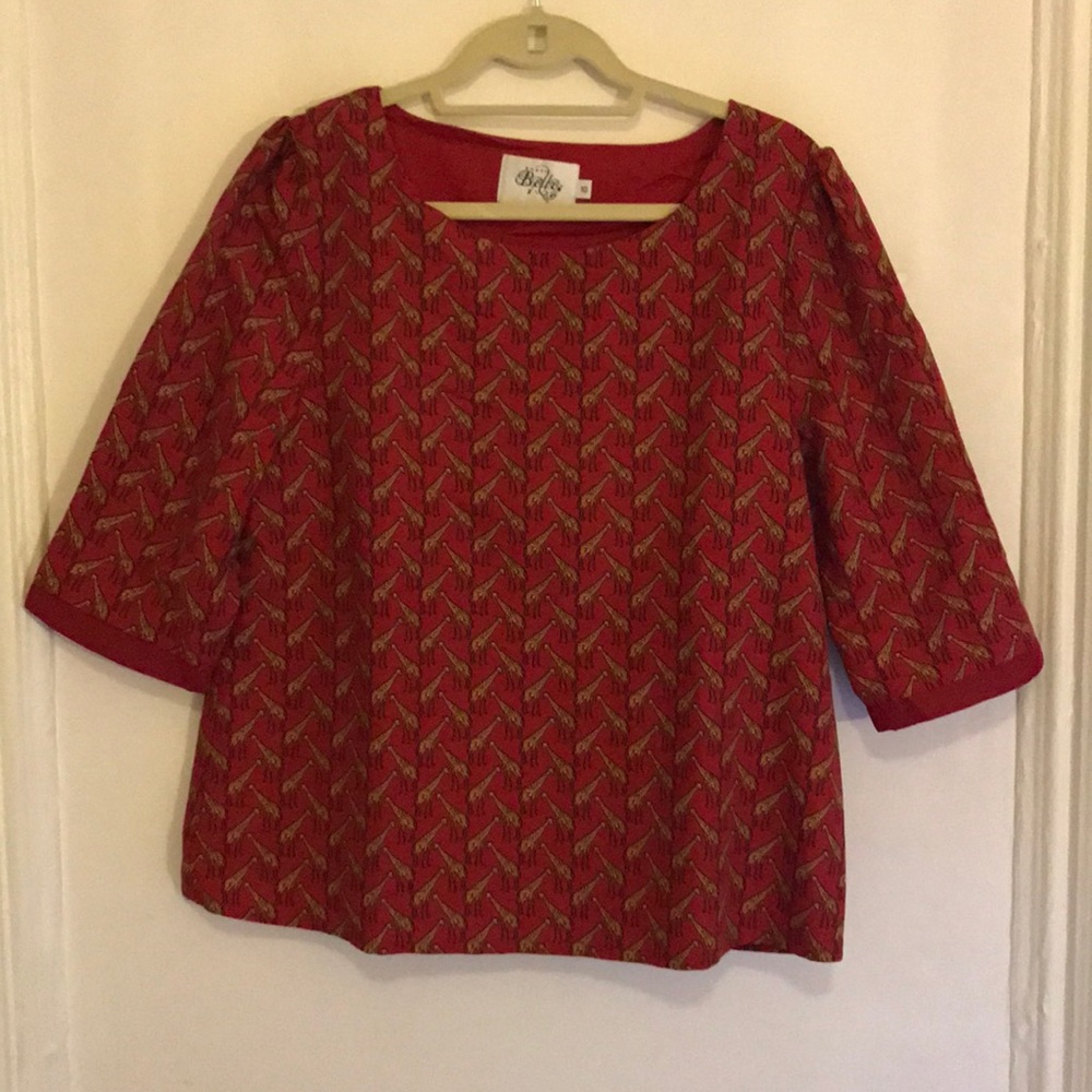 Anthropologie red shirt with giraffes