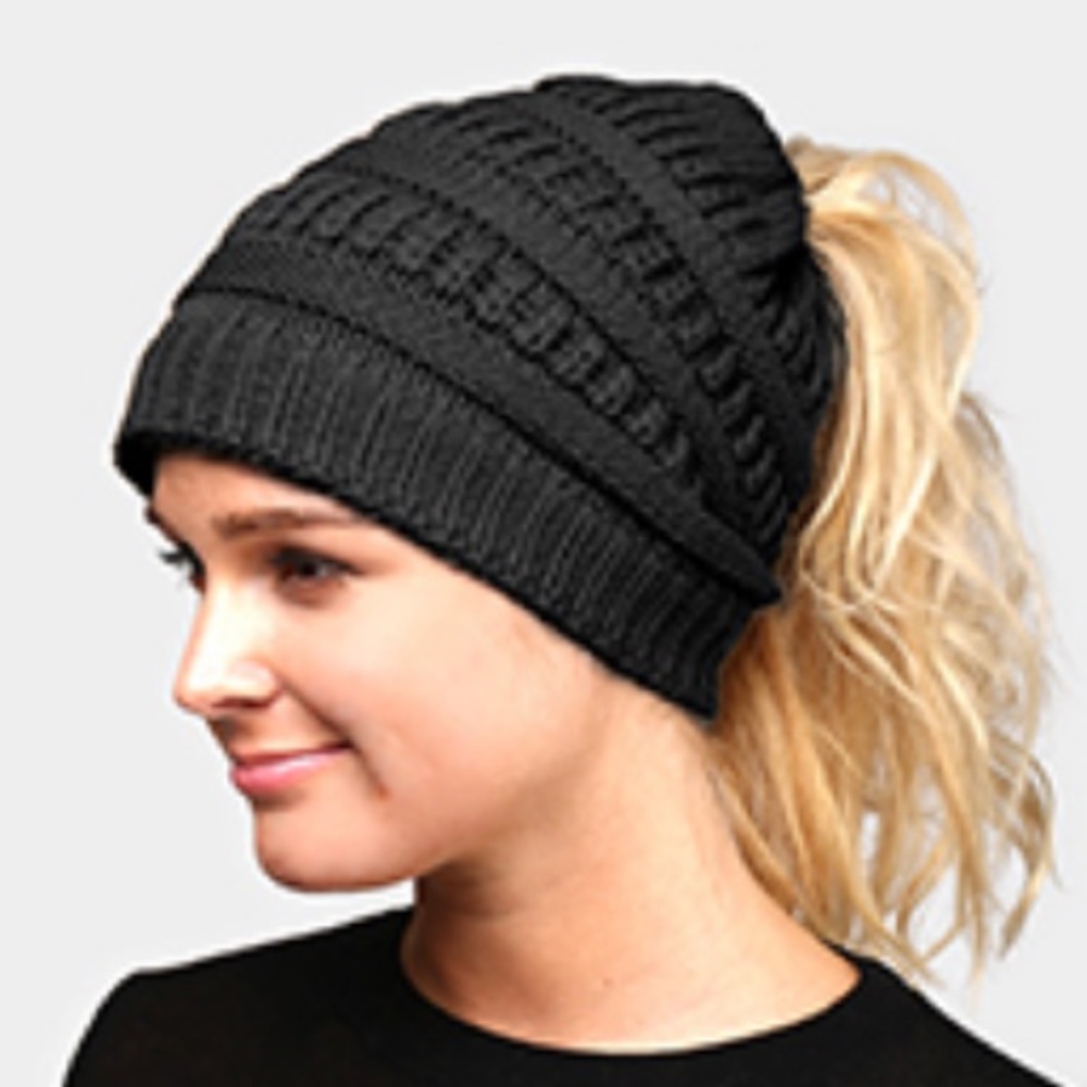 Black knit car with ponytail opening.