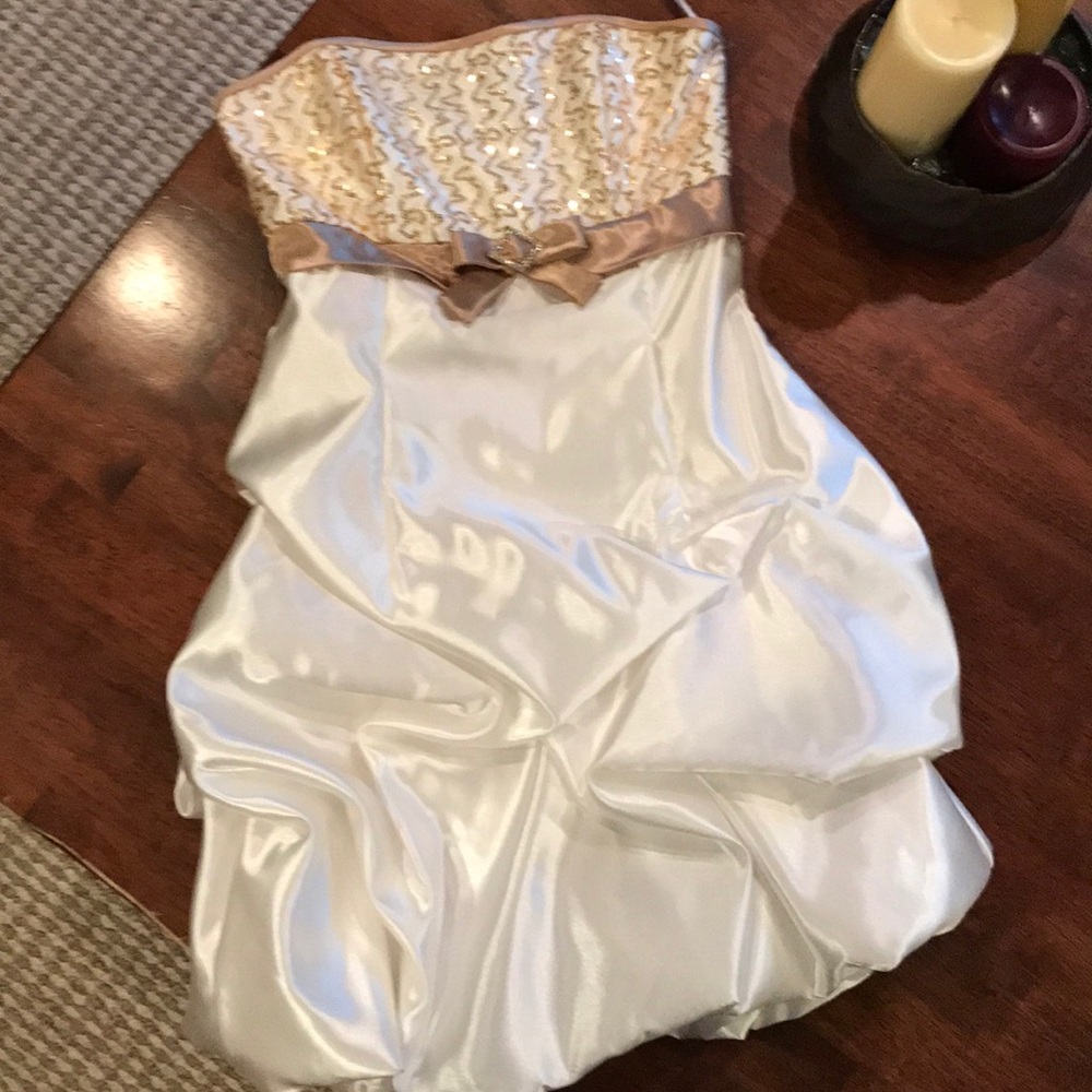 Short gold and white dress.