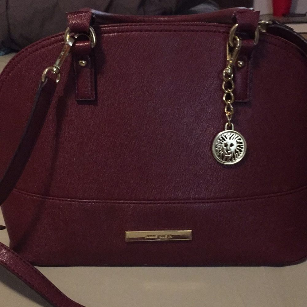Anne Klein ruby red suitcase bag.