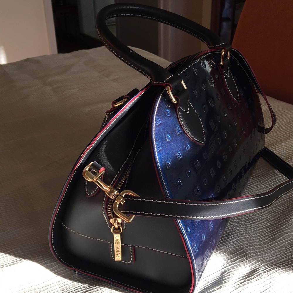 Blue patent leather handbag.