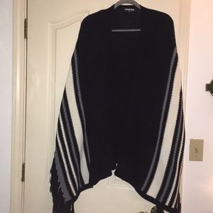black and white woven cape with tassels