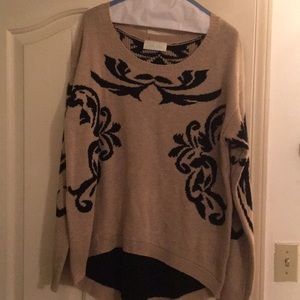 tan and black filigree woven sweater