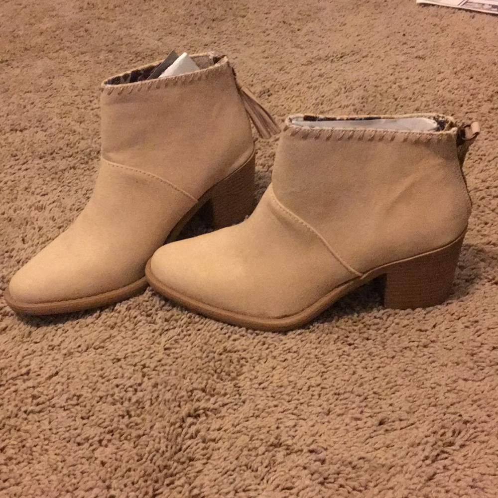 Tan high heeled ankle boots