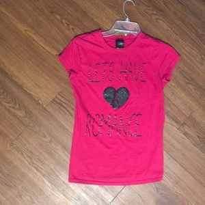 A pinkish-red “Let’s Have a Romance” Tee in Medium