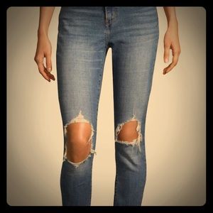 Levi’s 721 high rise skinnies with open knees