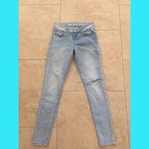Light blue distressed skinny jeans