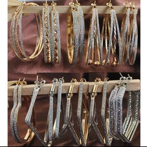 A Set Of Gold & Silver Hoop Earrings.