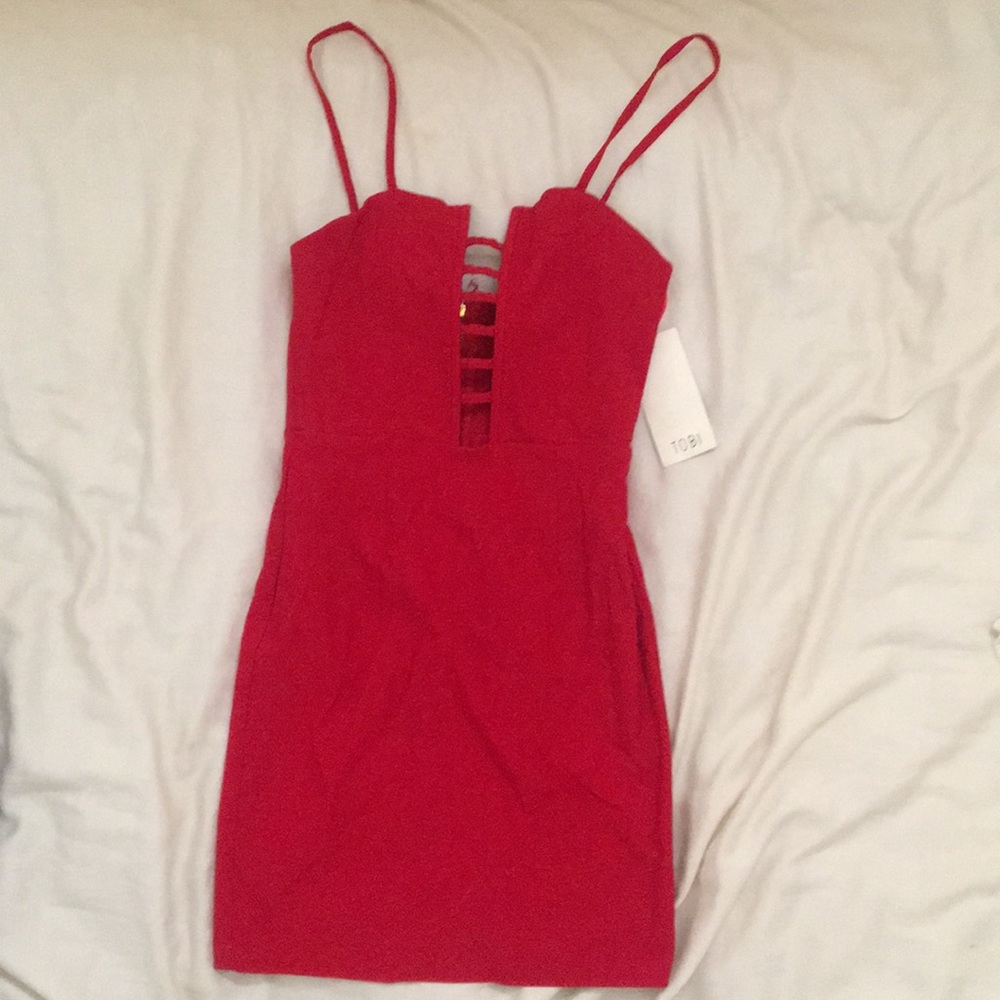 Red bodycon dress with cutouts and straps
