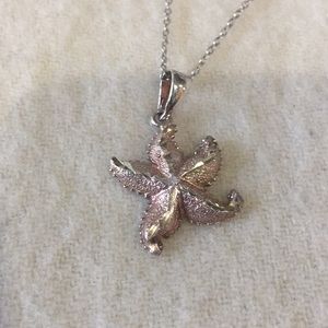 Silver starfish necklace with rose gold accents
