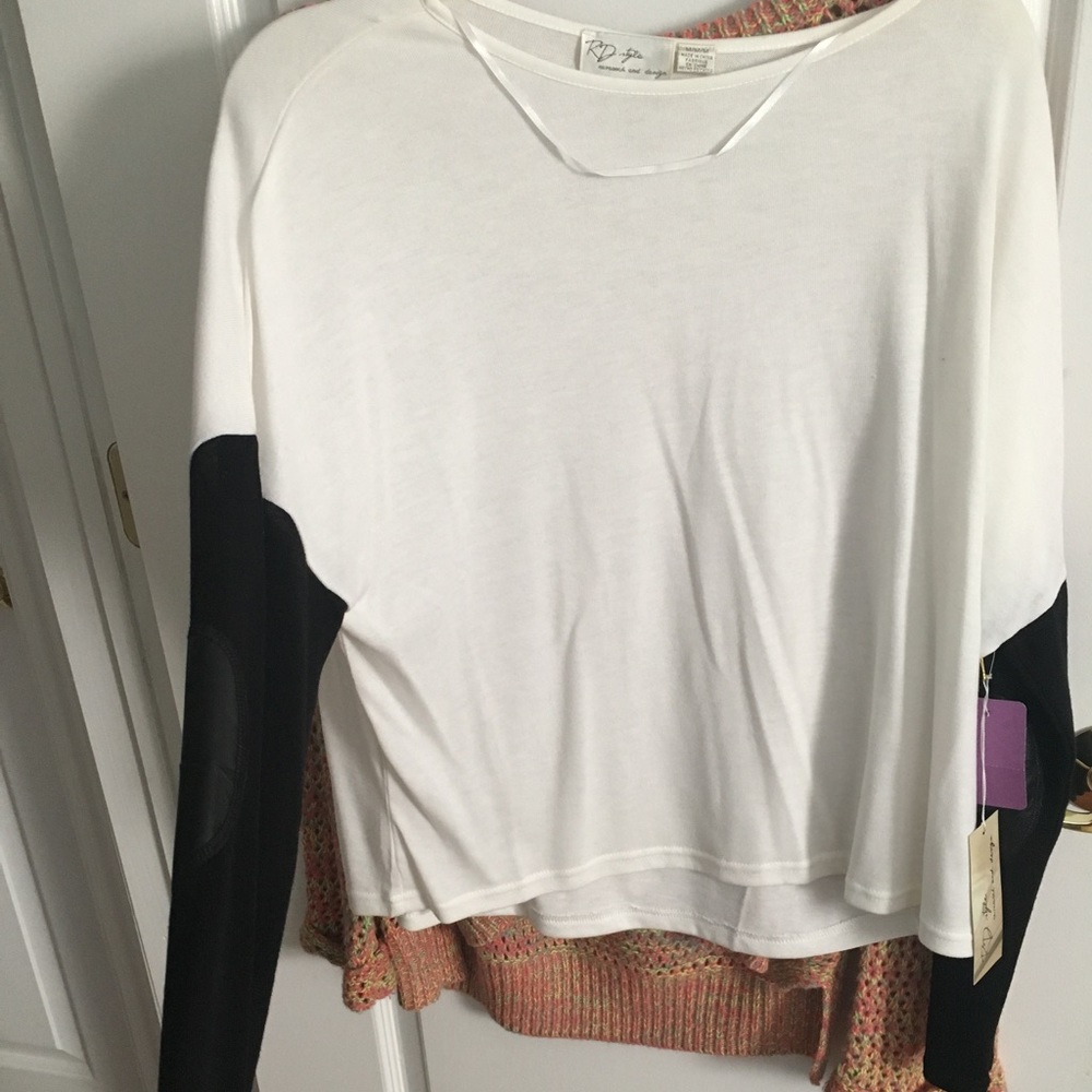 white box cut sweater black sleeves with leather