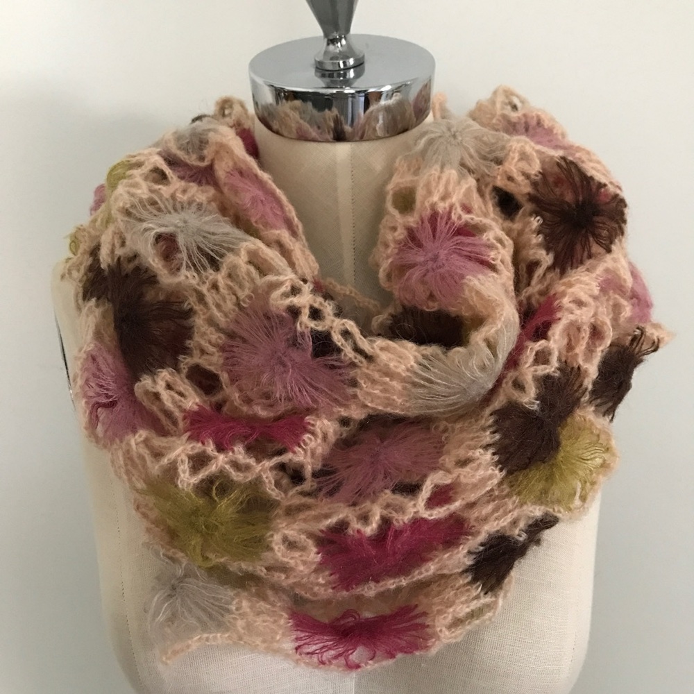 Multi colored knit scarf by Anthropologie.