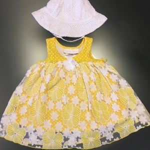 Yellow floral sundress and white sun hat