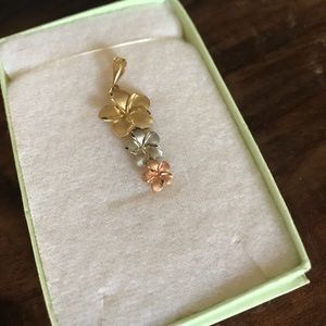 Gold silver and rose gold plumeria flower pendant