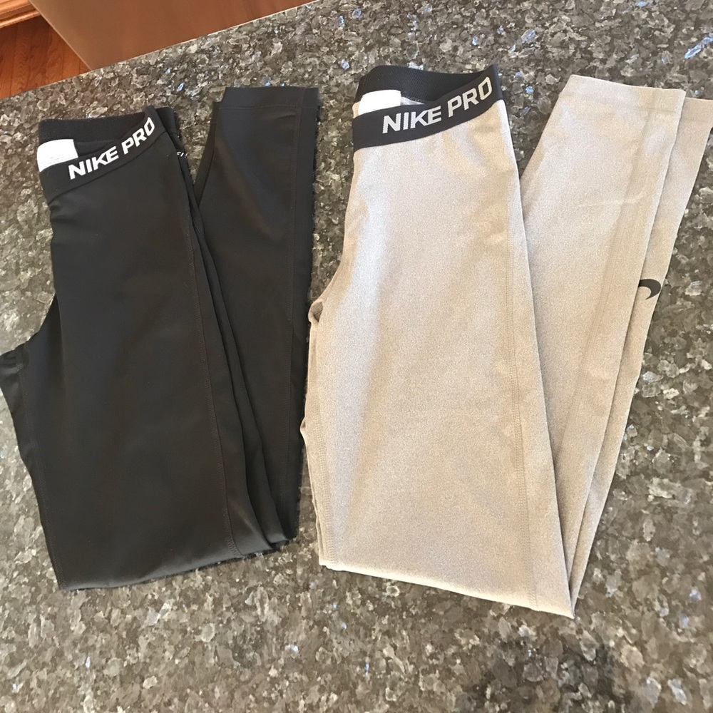 Two pairs of Nike Pro pants.