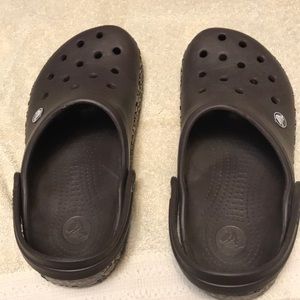 Brown and leopard crocs