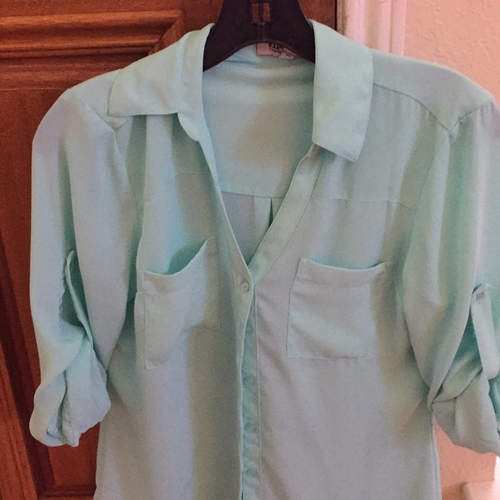 A mint color top from Express