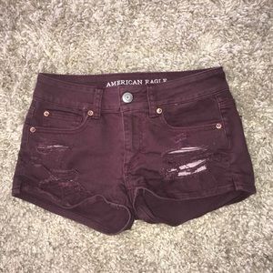 Maroon ripped jean shorts