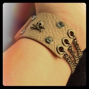 Punk/goth/pirate tan cuff bracelet.