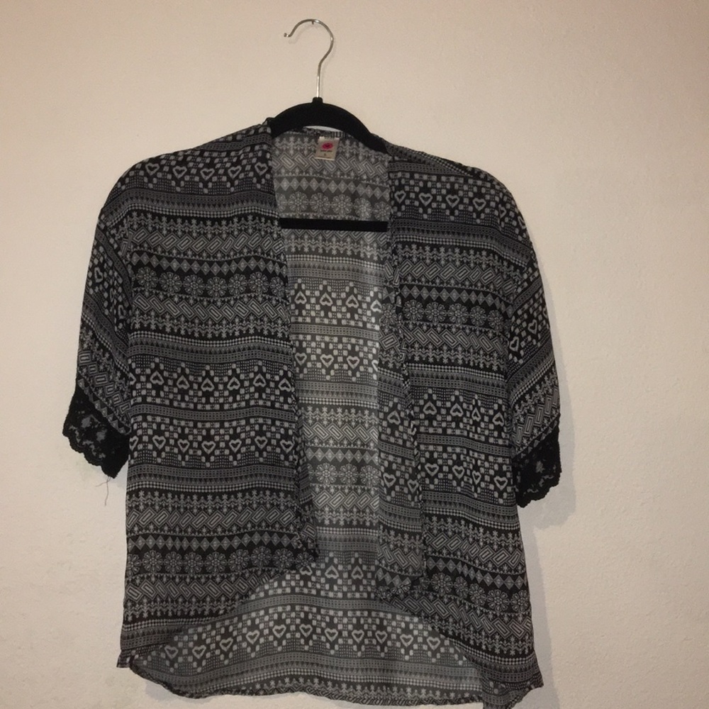 A black and white kimono with a tribal print.