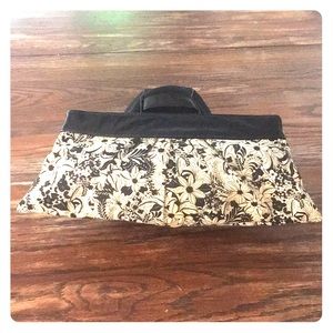 Lauren Merkin flower clutch with patent top.