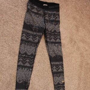 Nike leggings with gold swoosh