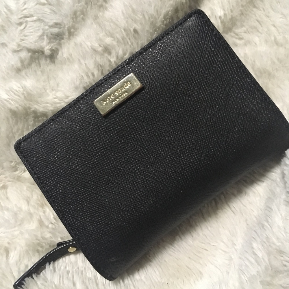 Barely used Navy blue Kate Spade wallet.
