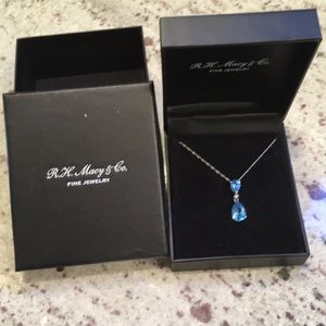 Light blue (topaz 14k) tear drop necklace.