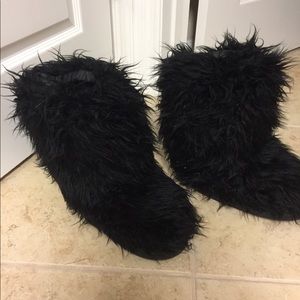 Black fuzzy boots. Never worn; no tags attached.