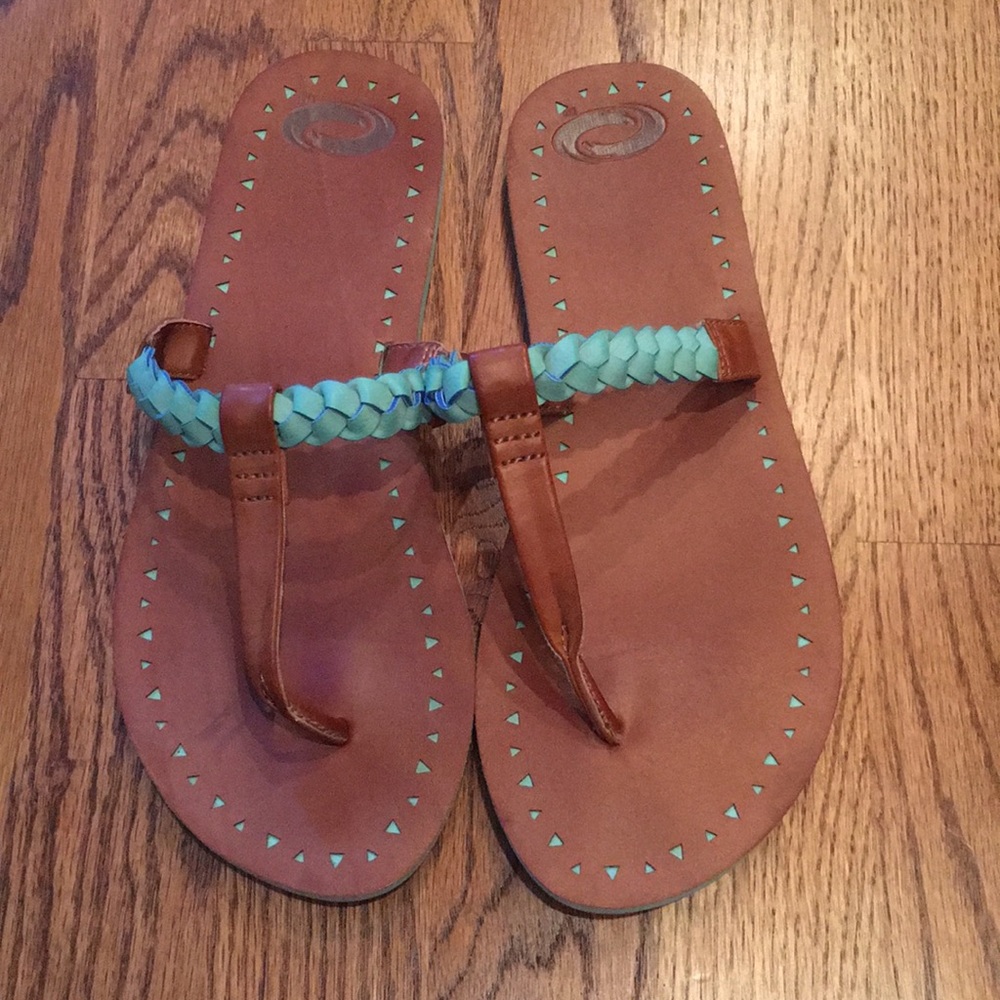 Aqua and tan flip flops