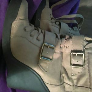 Tan boots with a wedge.
