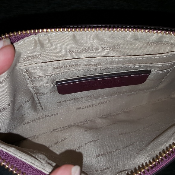 Michael Kors plum color clutch. - Picture 2 of 3
